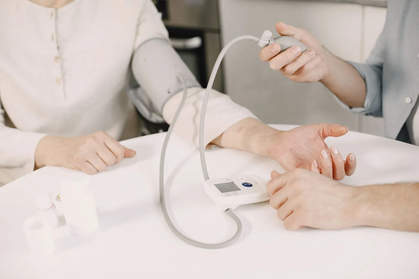 Best Blood Pressure Supplements (2026): 2 Picks We Rate Honestly 4 Blood pressure being measured with a home monitor, pill bottles on the table