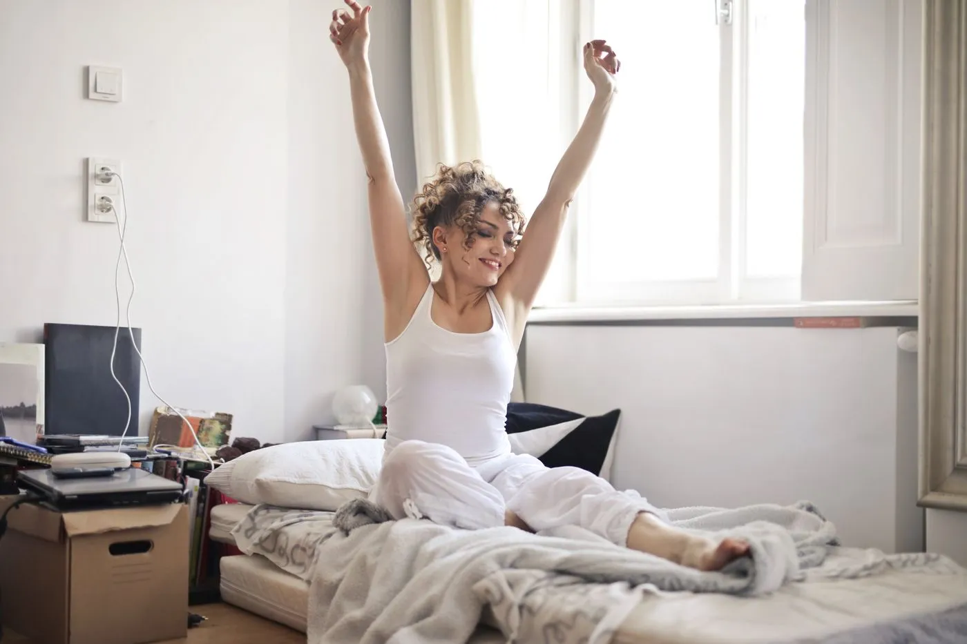 GlucoTrust Reviews: Does This Blood Sugar Supplement Work? 4 Woman waking up refreshed with steady energy