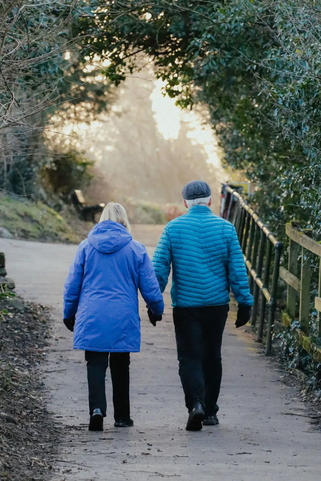 An active senior couple walking together outdoors