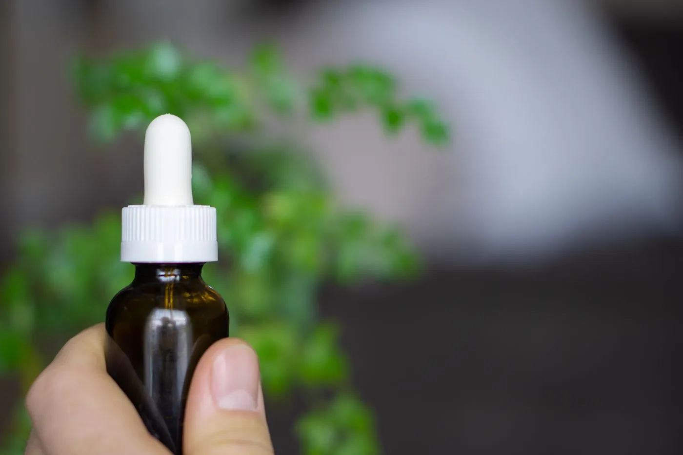 Kerassentials Reviews: Does This Nail & Skin Oil Really Work? 5 Applying a nail and skin oil with a dropper