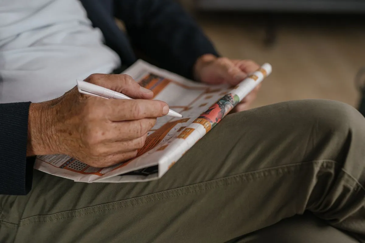 MemoShield Reviews: Does This Memory Supplement Work? 4 Older man doing a crossword, keeping his mind sharp