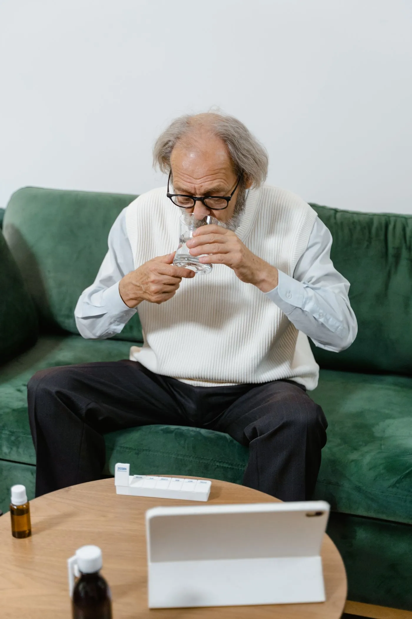 Protoflow Reviews: Does This Prostate Supplement Work? 5 Man taking a daily capsule with a glass of water