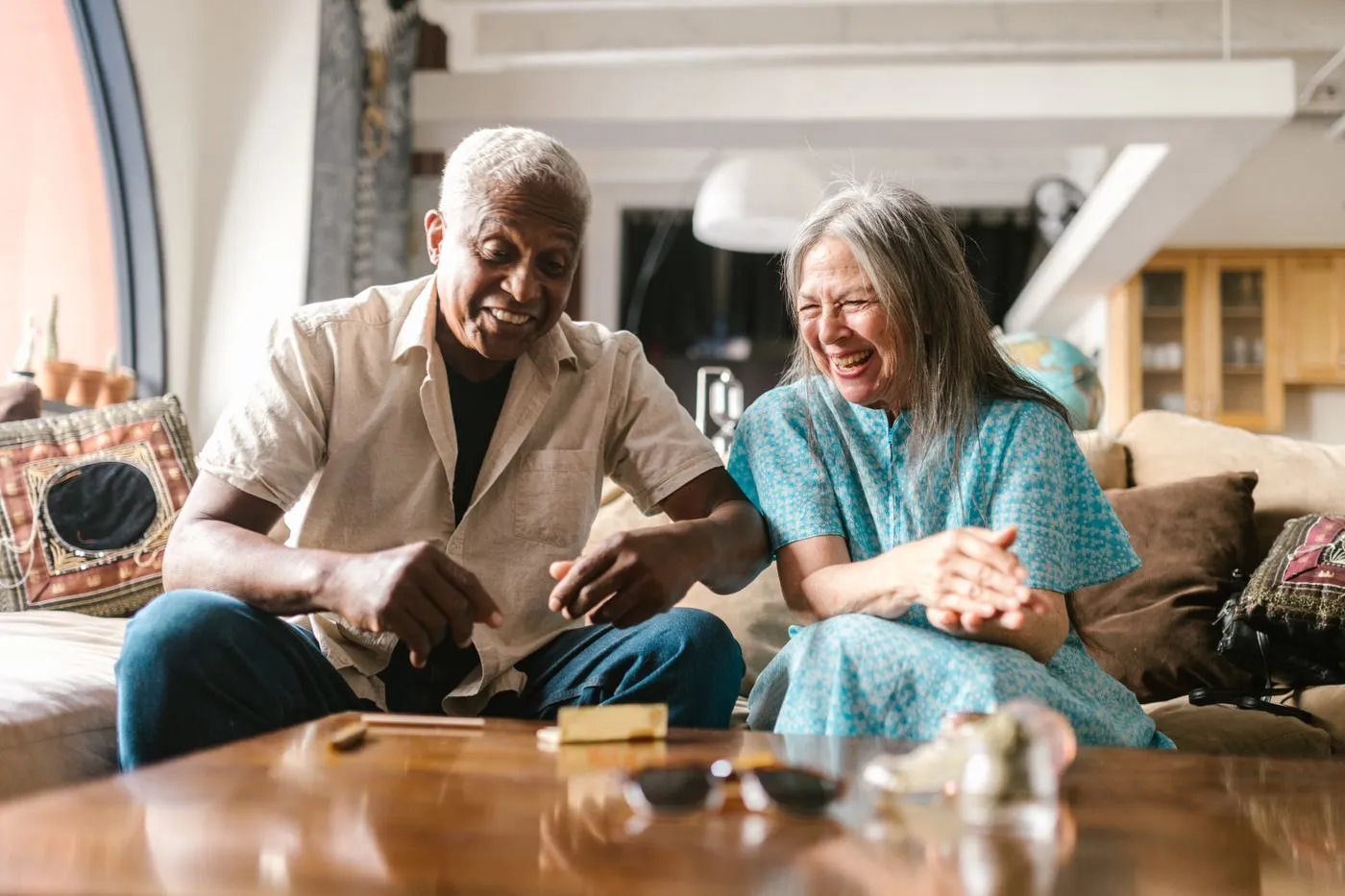 Quietum Plus Reviews: Does This Hearing Supplement Really Work? 4 Happy senior couple laughing and chatting together at home